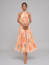 Renata | Vestido Midi Coral Floral com Decote Halter e Saia Plissada
